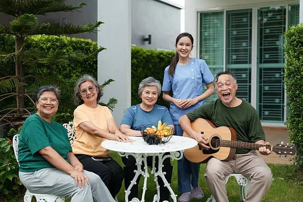 Residents enjoying live guitar music in the garden