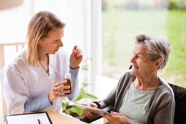 A nurse talking with a resident
